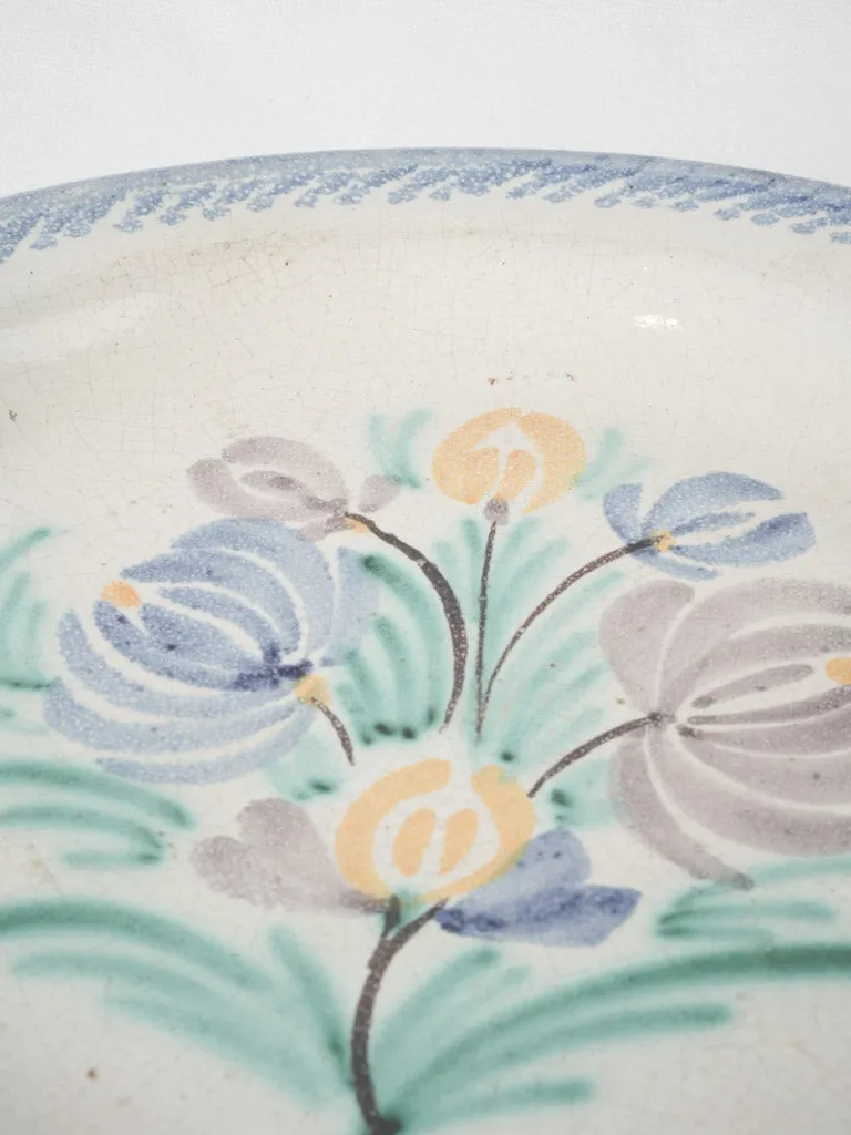 20th-century white glazed terra cotta plate w/ floral motifs 11¾"