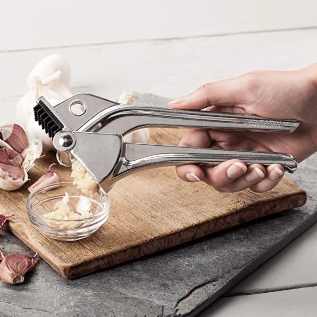 Royal Industries 7 inch Aluminum Garlic Press  This garlic press features pressing nubs that force the garlic through a stainless steel blade. It is extremely easy cleaning and won't leave your hands smelling like garlic all day-ROY GP