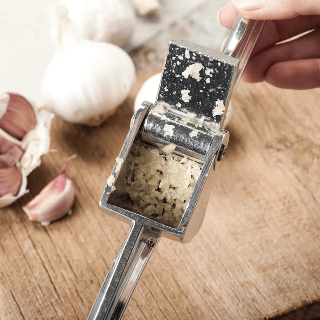 Royal Industries 7 inch Aluminum Garlic Press  This garlic press features pressing nubs that force the garlic through a stainless steel blade. It is extremely easy cleaning and won't leave your hands smelling like garlic all day-ROY GP