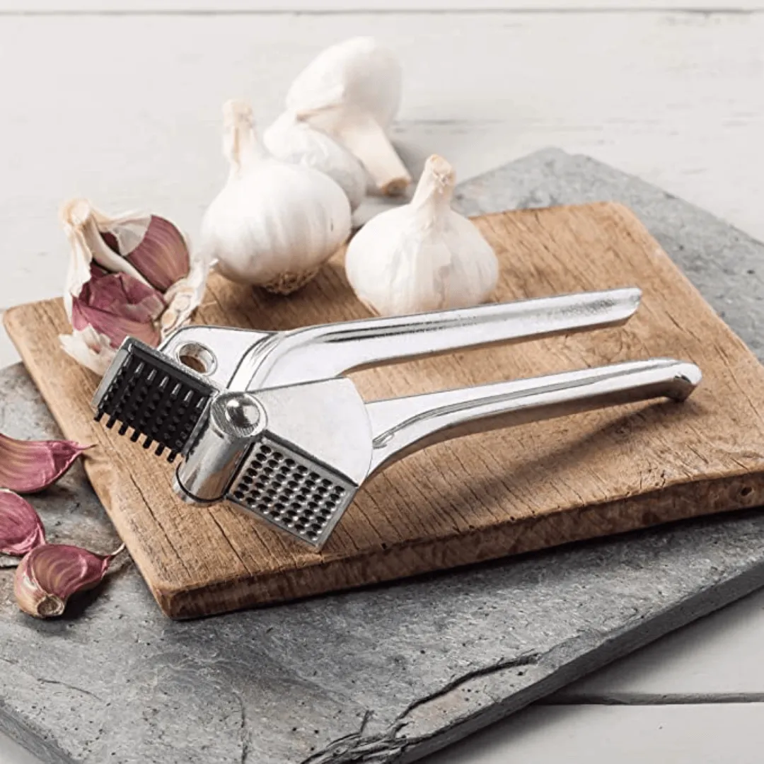 Royal Industries 7 inch Aluminum Garlic Press  This garlic press features pressing nubs that force the garlic through a stainless steel blade. It is extremely easy cleaning and won't leave your hands smelling like garlic all day-ROY GP